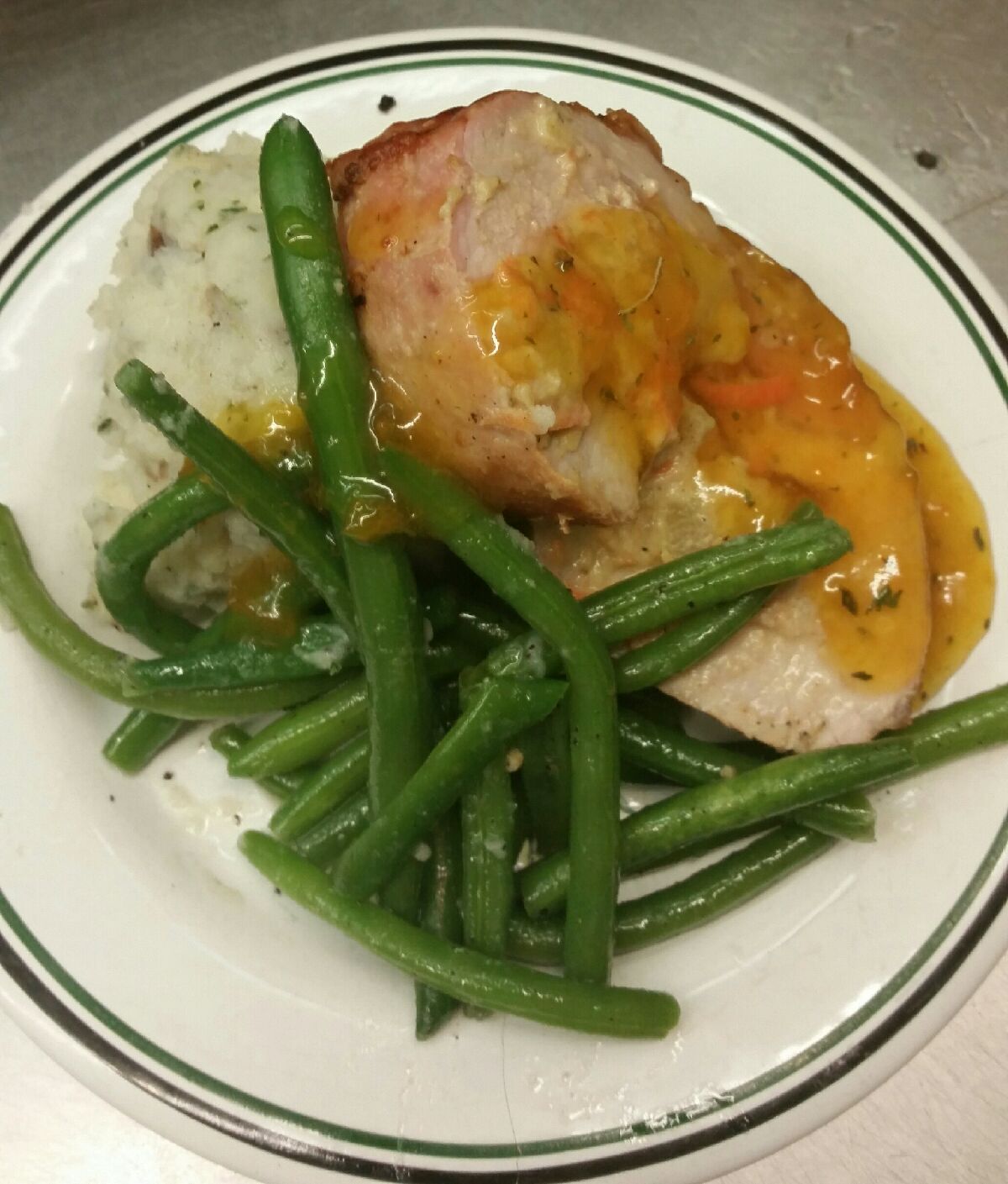 Stuffed Pork Loin with Mashed Potatoes and Green Beans